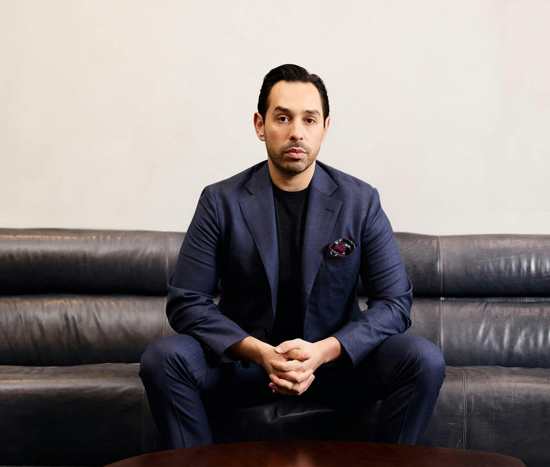 Dr. parizh sitting on couch
