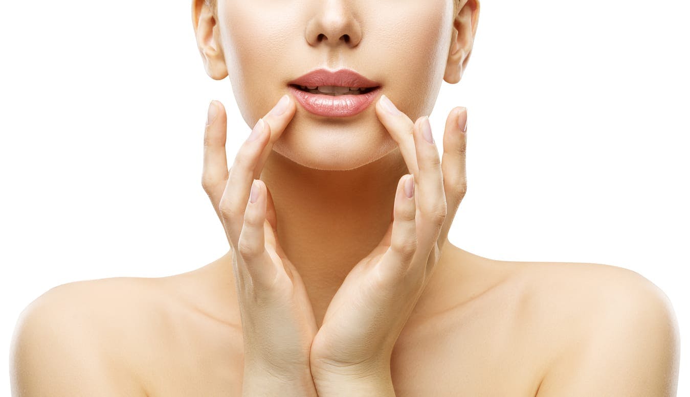 woman with a close-up on lip and hands framing mouth