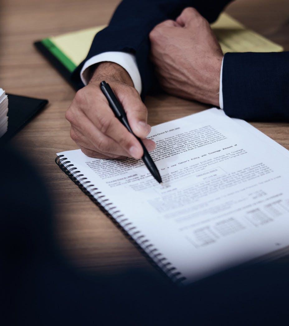 attorney pointing to a paper