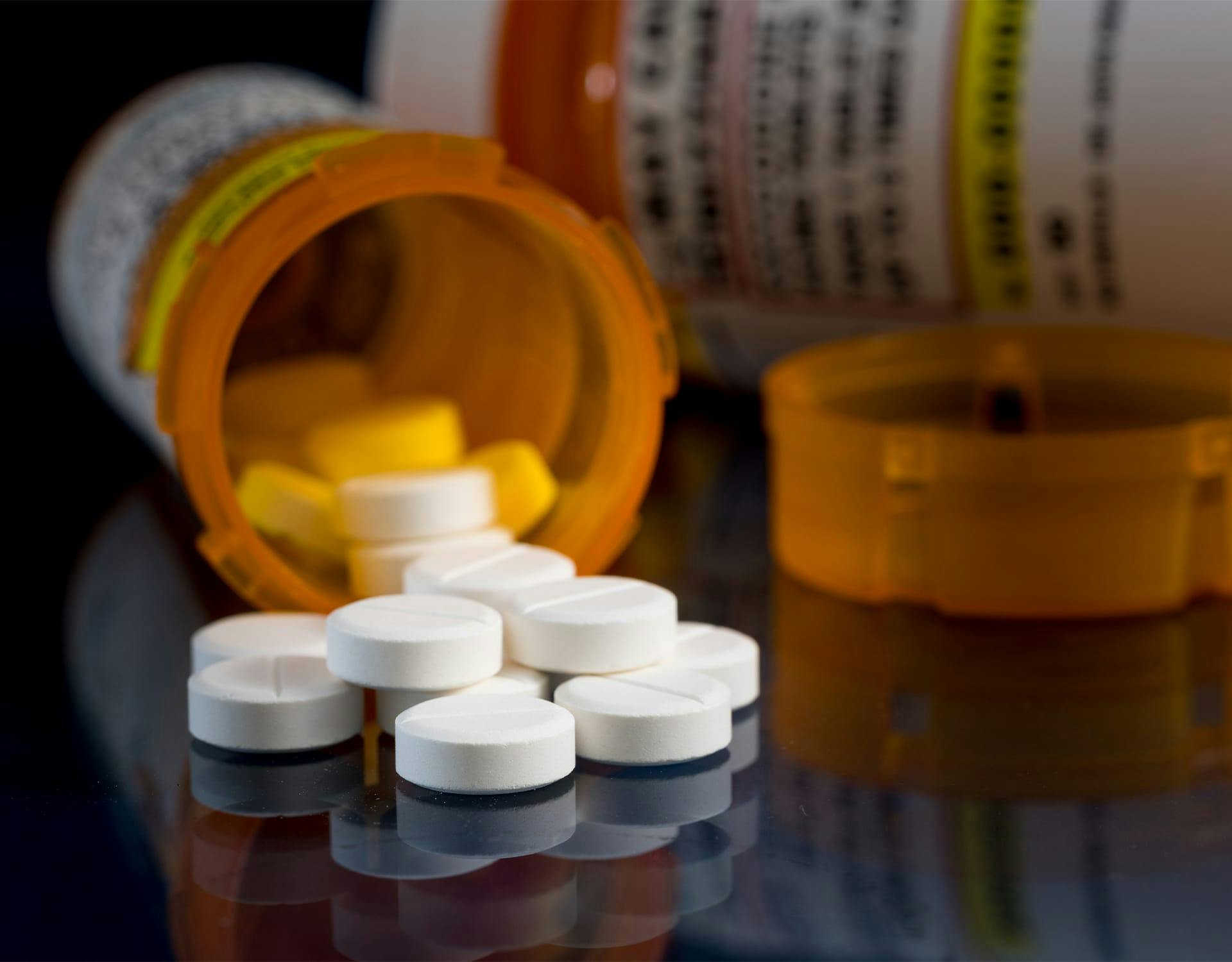 prescription pills spilling out the bottle