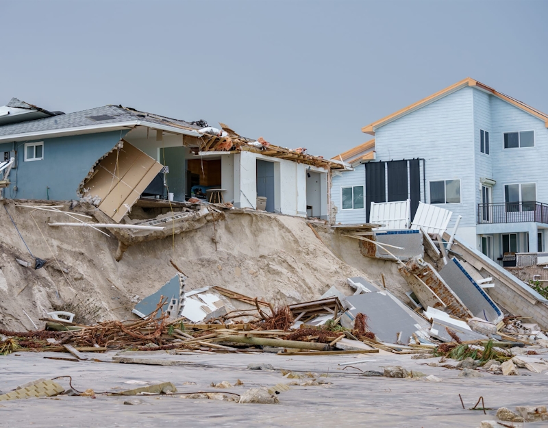 house falling off a cliff