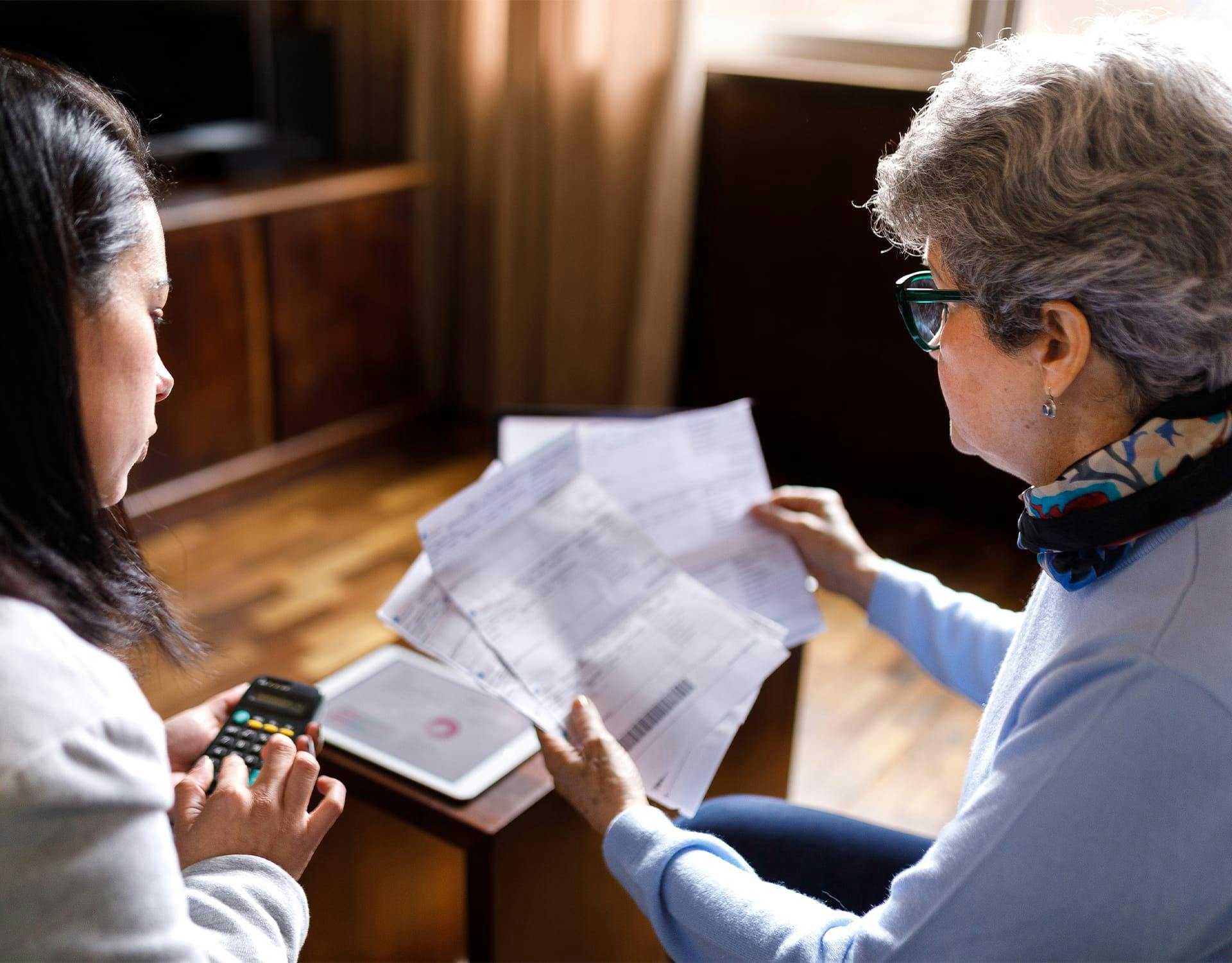 two people looking at documents
