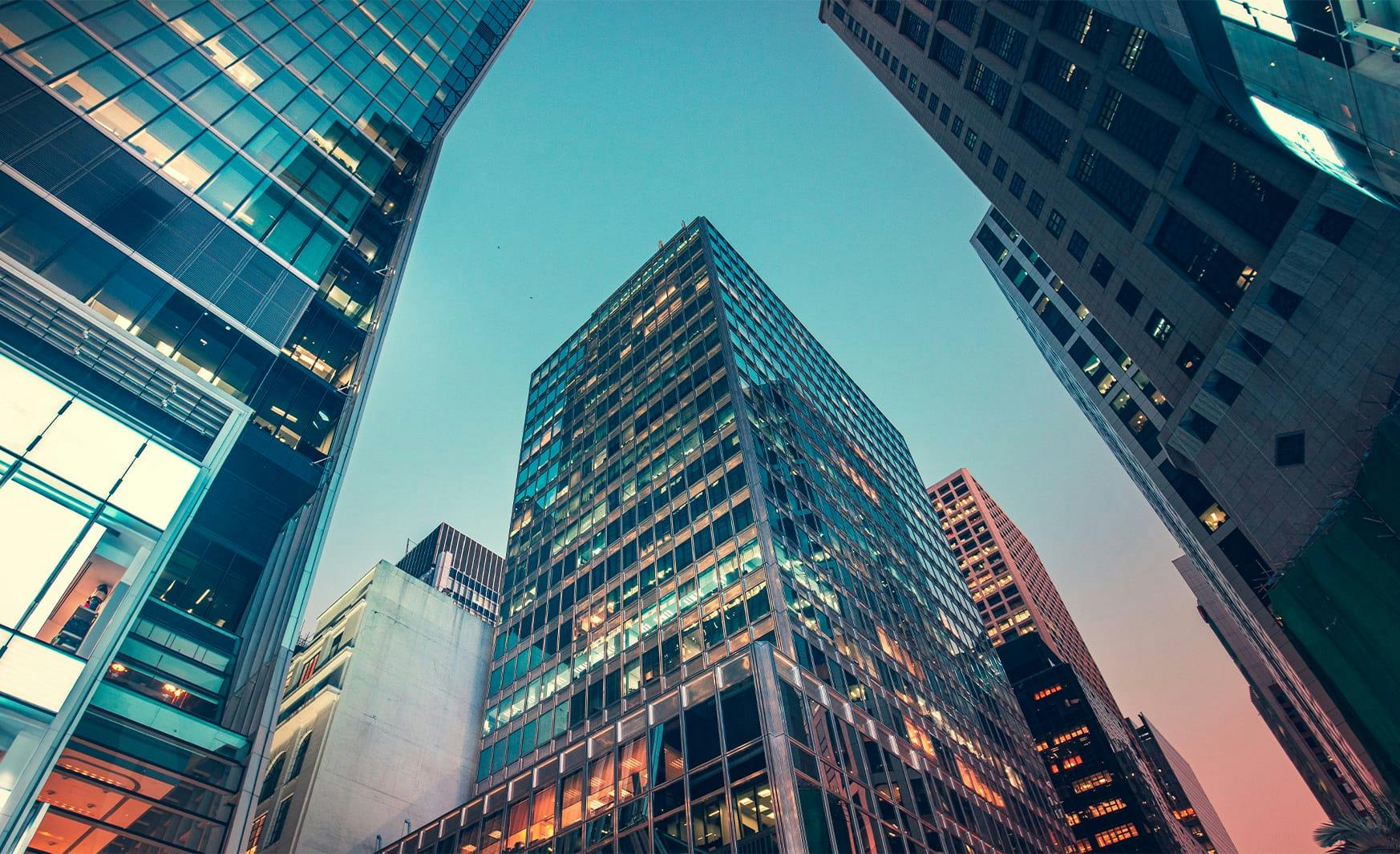 view looking up at tall buildings