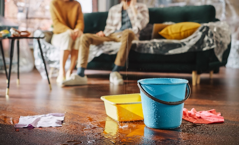 buckets under a leak in a house