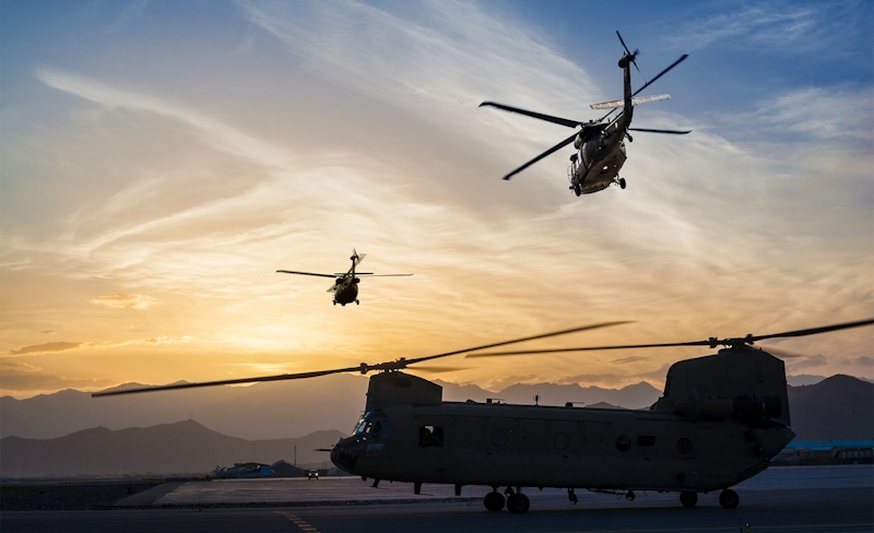 man in suit looking over binder with woman