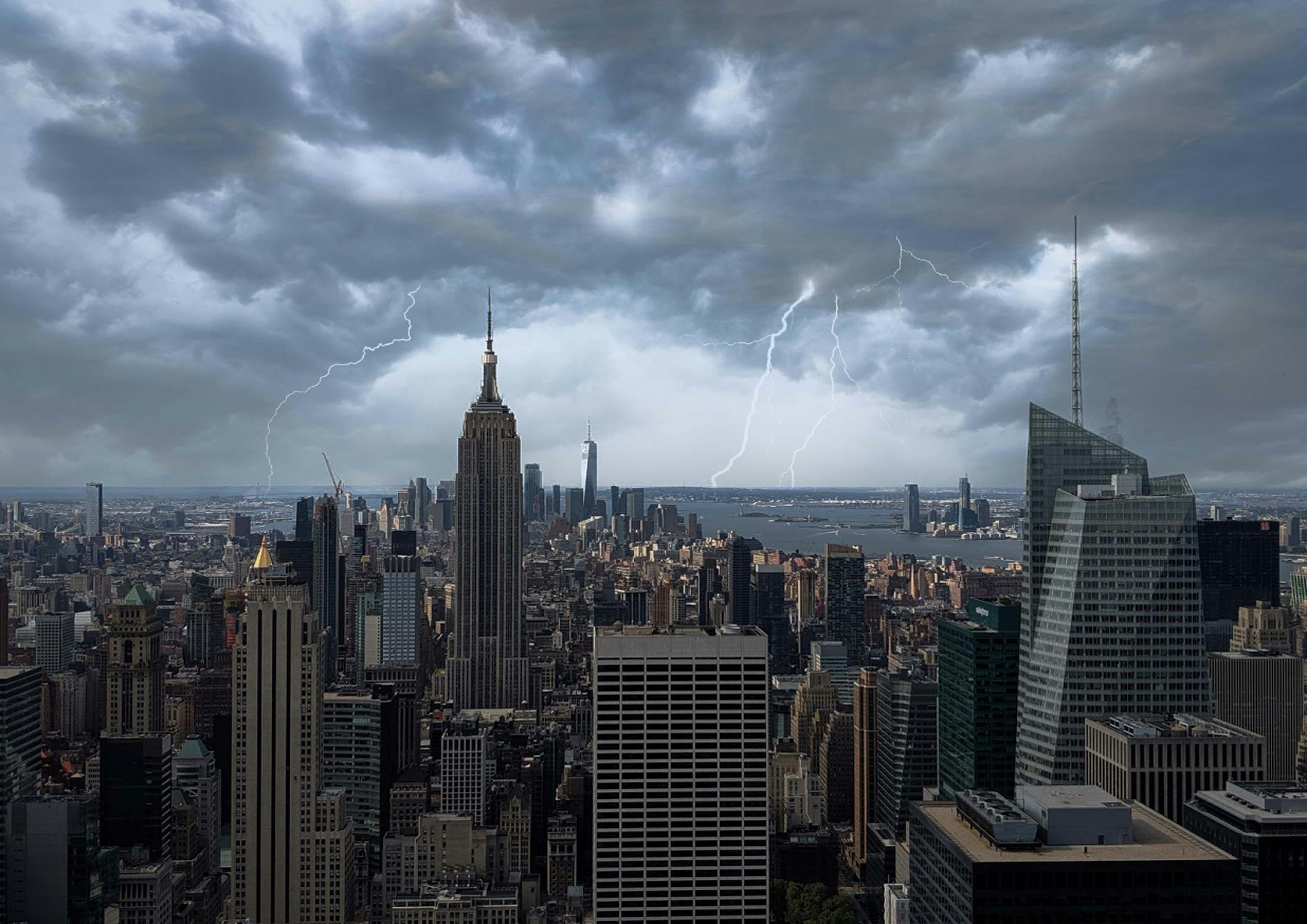 View of New York City skyline under dark storm clouds with visible lightning strikes in the distance.
