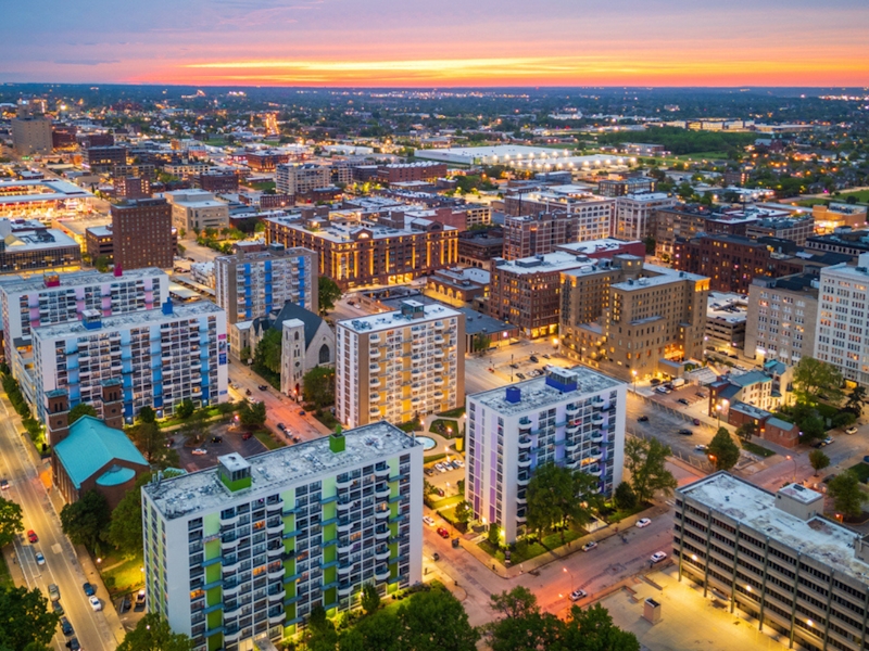 downtown city apartment blocks at dusk.
