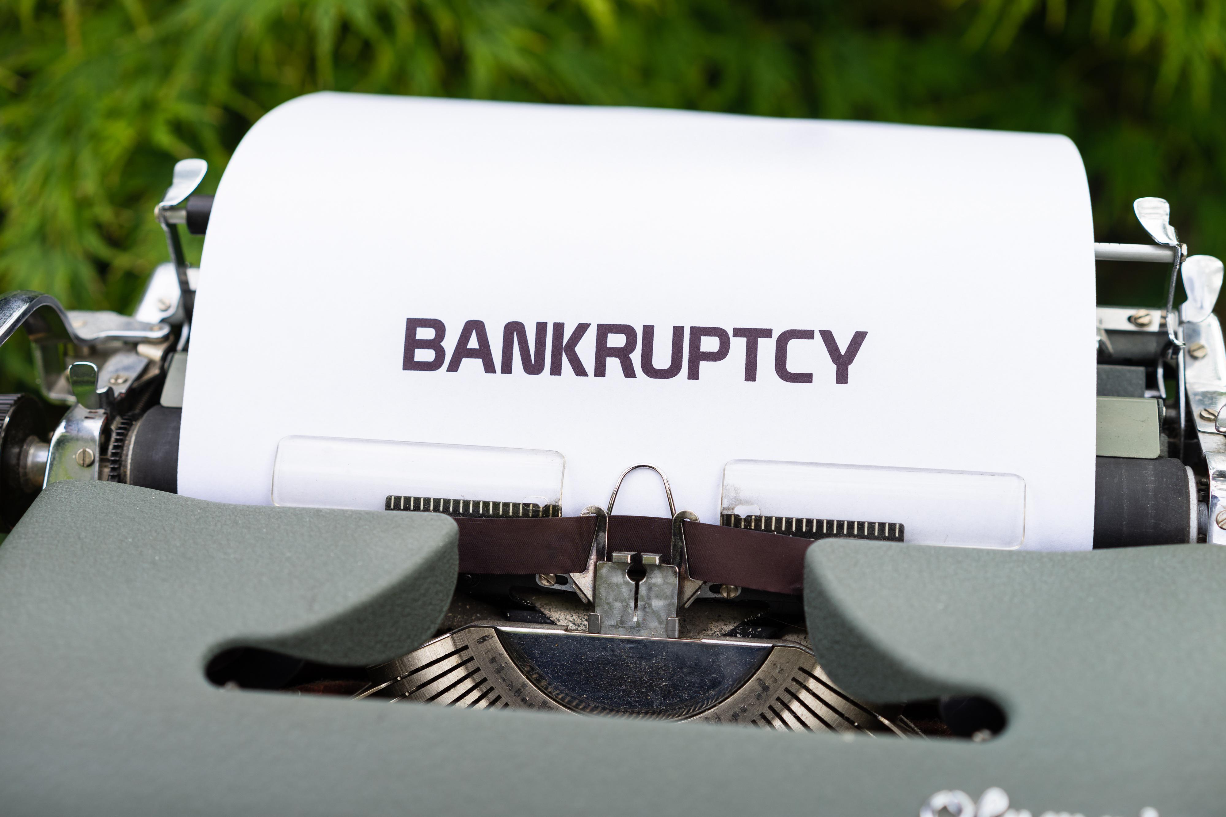 Close-up image of the word &ldquo;Bankruptcy&rdquo; typed on paper, representing Chapter 11 protection and financial challenges.
