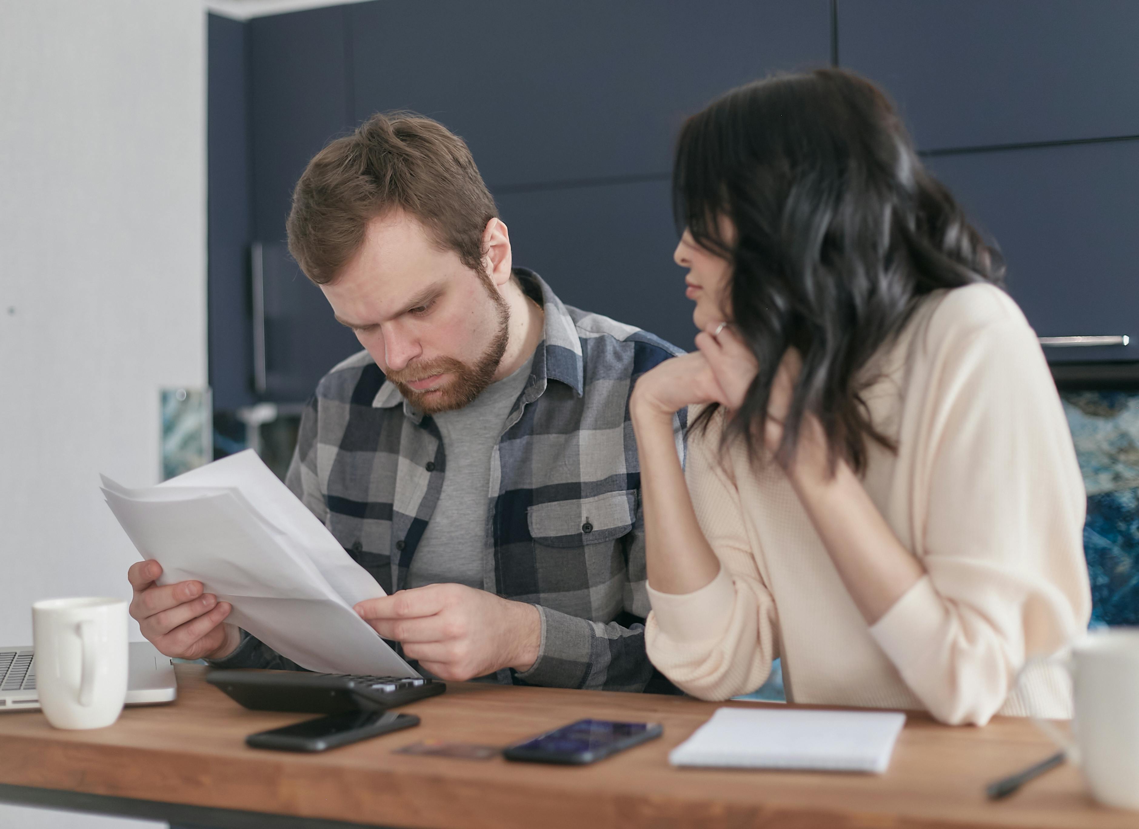 Couple discussing denied hurricane insurance claim