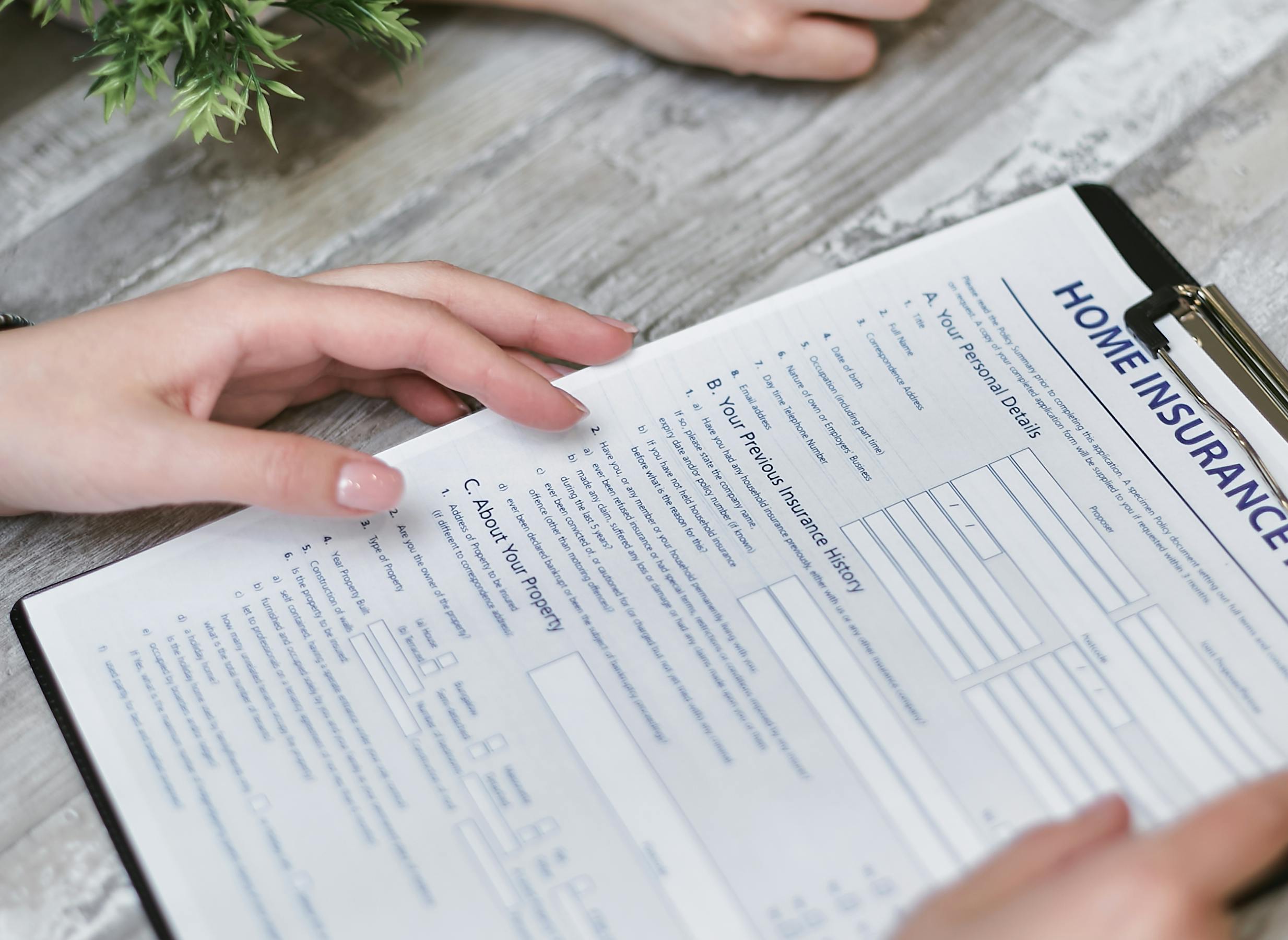Homeowner reviewing hurricane insurance claim paperwork