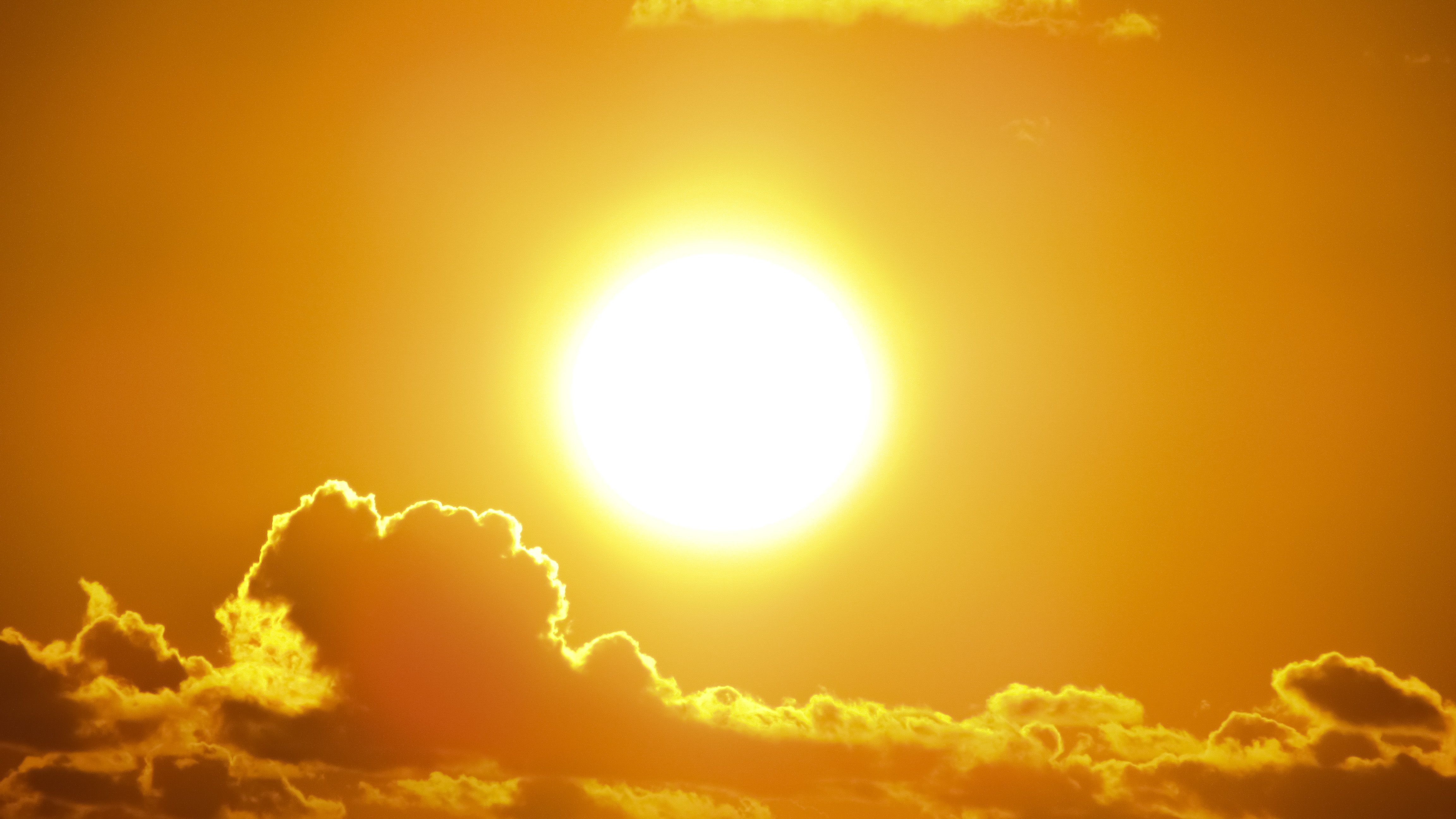 Bright summer sun and extreme heat conditions that can impact homes, roofing systems, and air conditioning units.