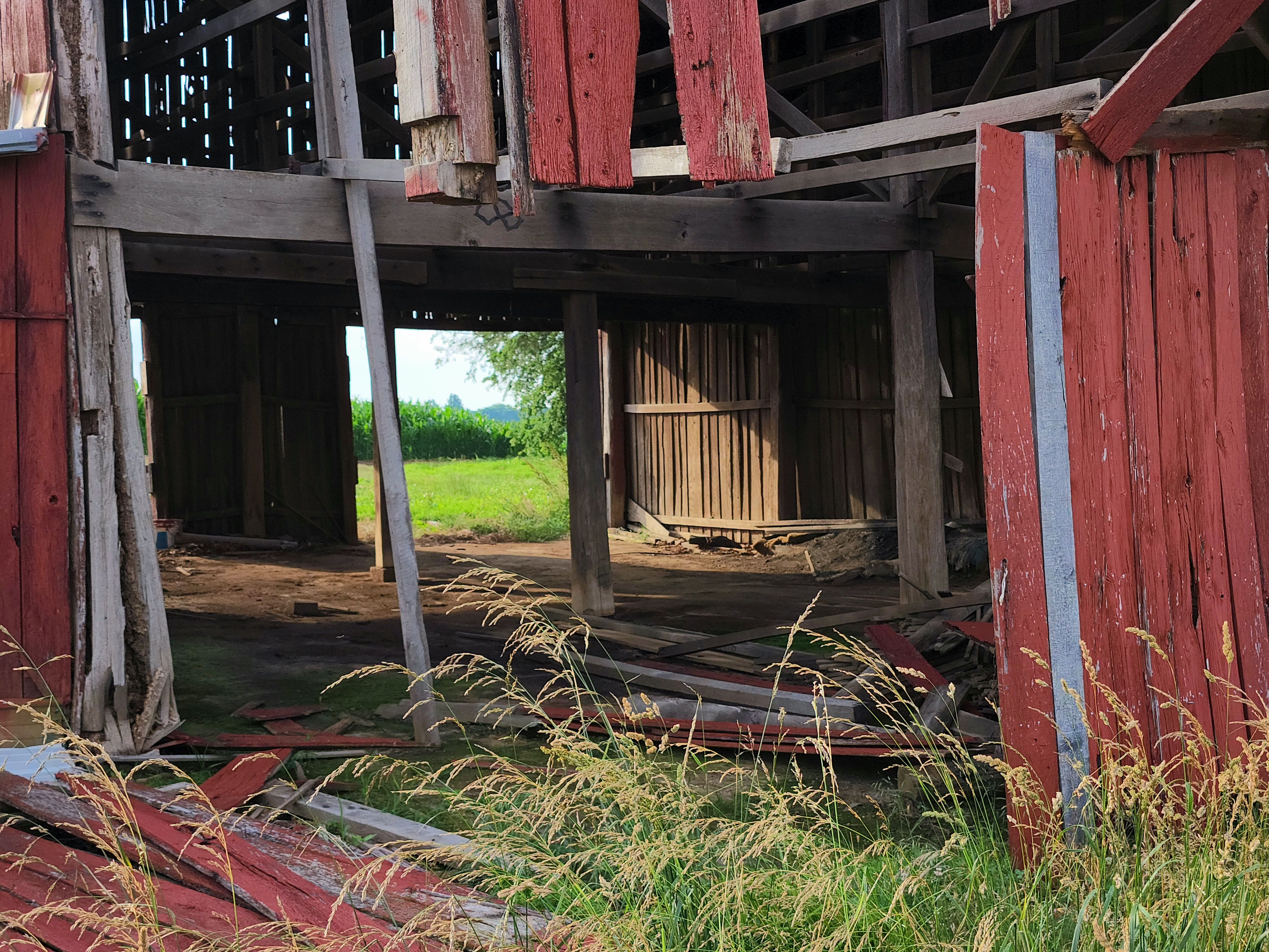 Tornado-damaged barn in Illinois showing severe structural damage caused by strong winds and a powerful storm.