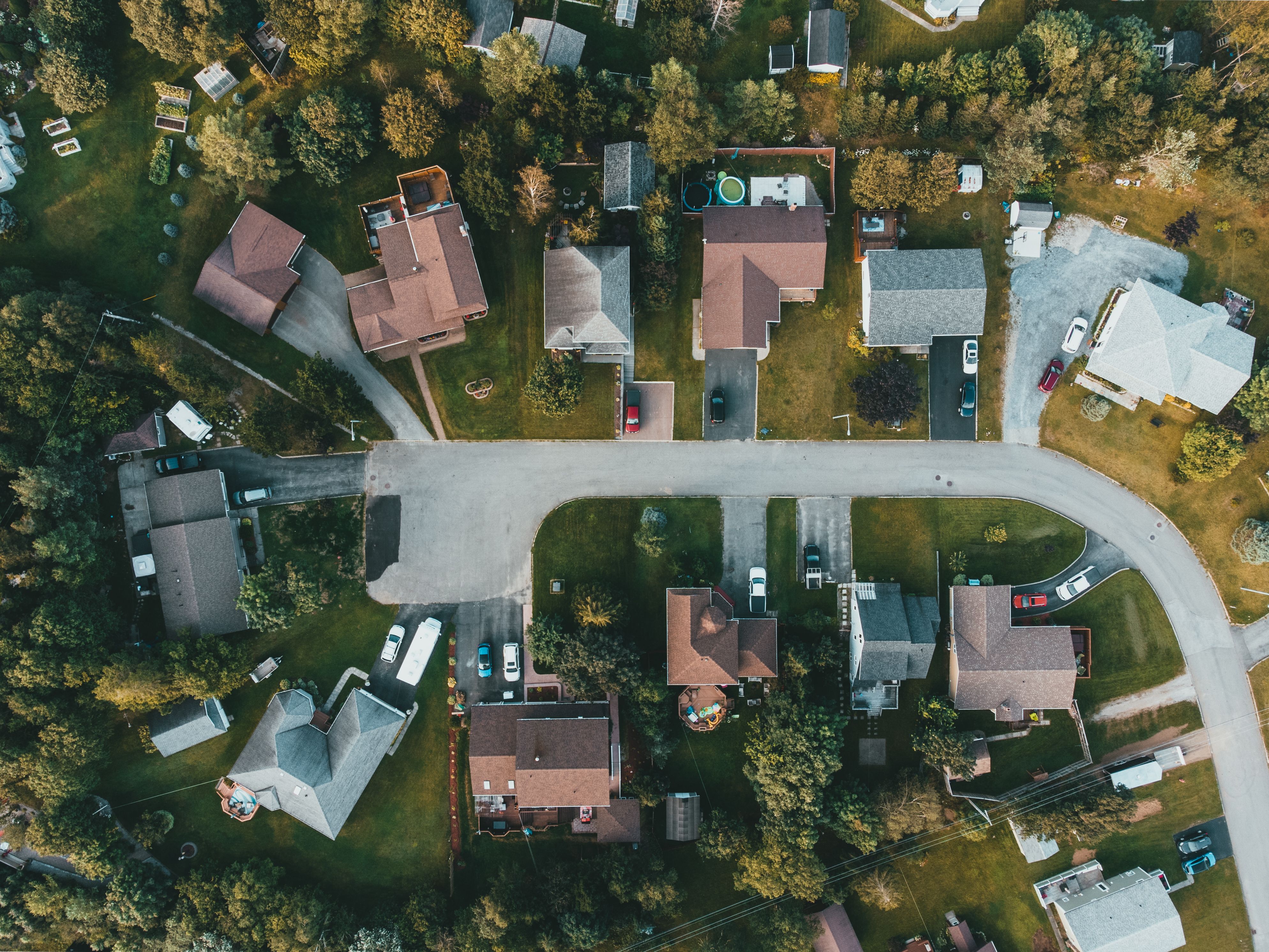 Aerial view of residential homes covered by property insurance