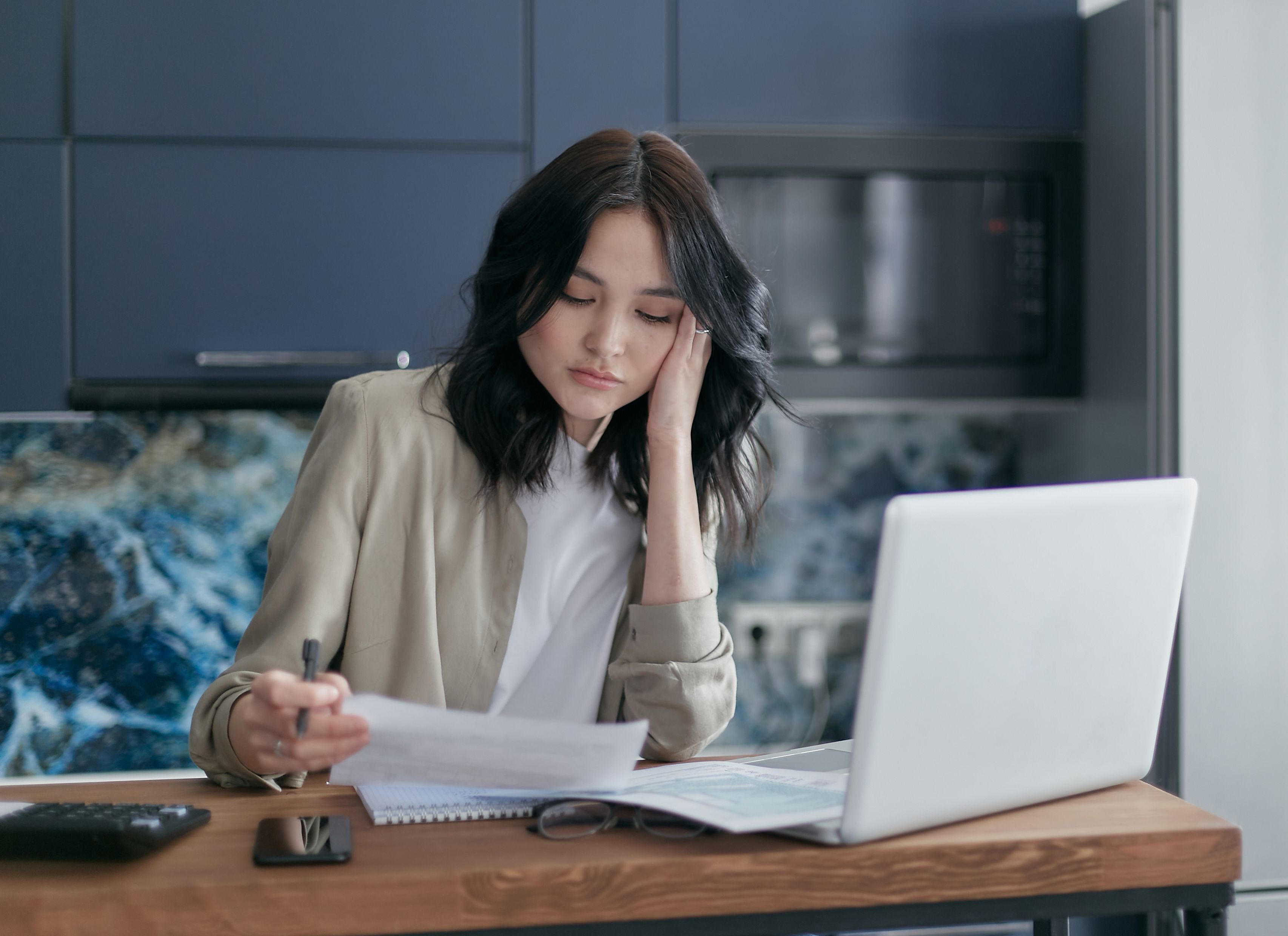 Homeowner reviewing documents after an insurance claim