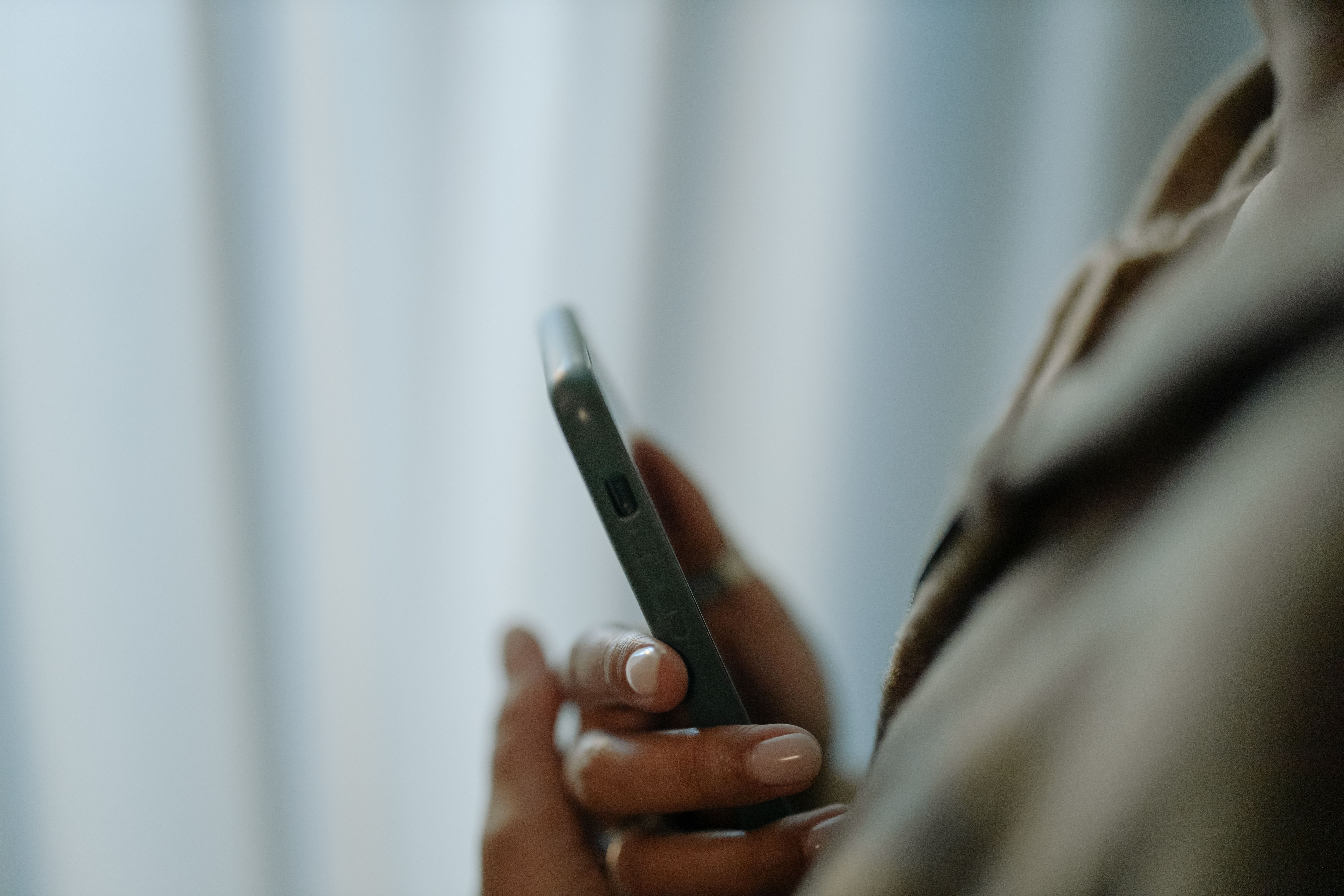 Homeowner using a phone to report an insurance claim