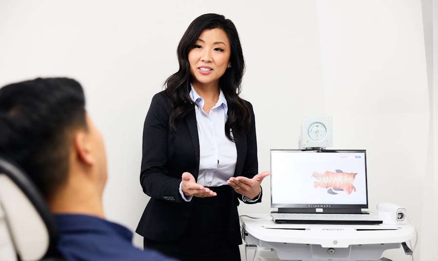 dr lucy speaking to patient about his teeth