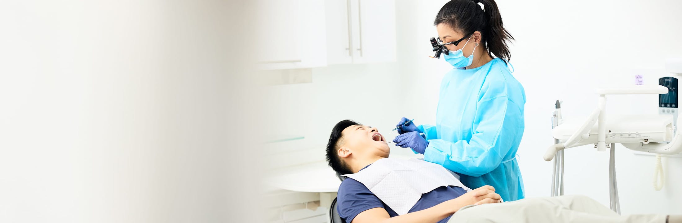 dr lucy looking into patients teeth