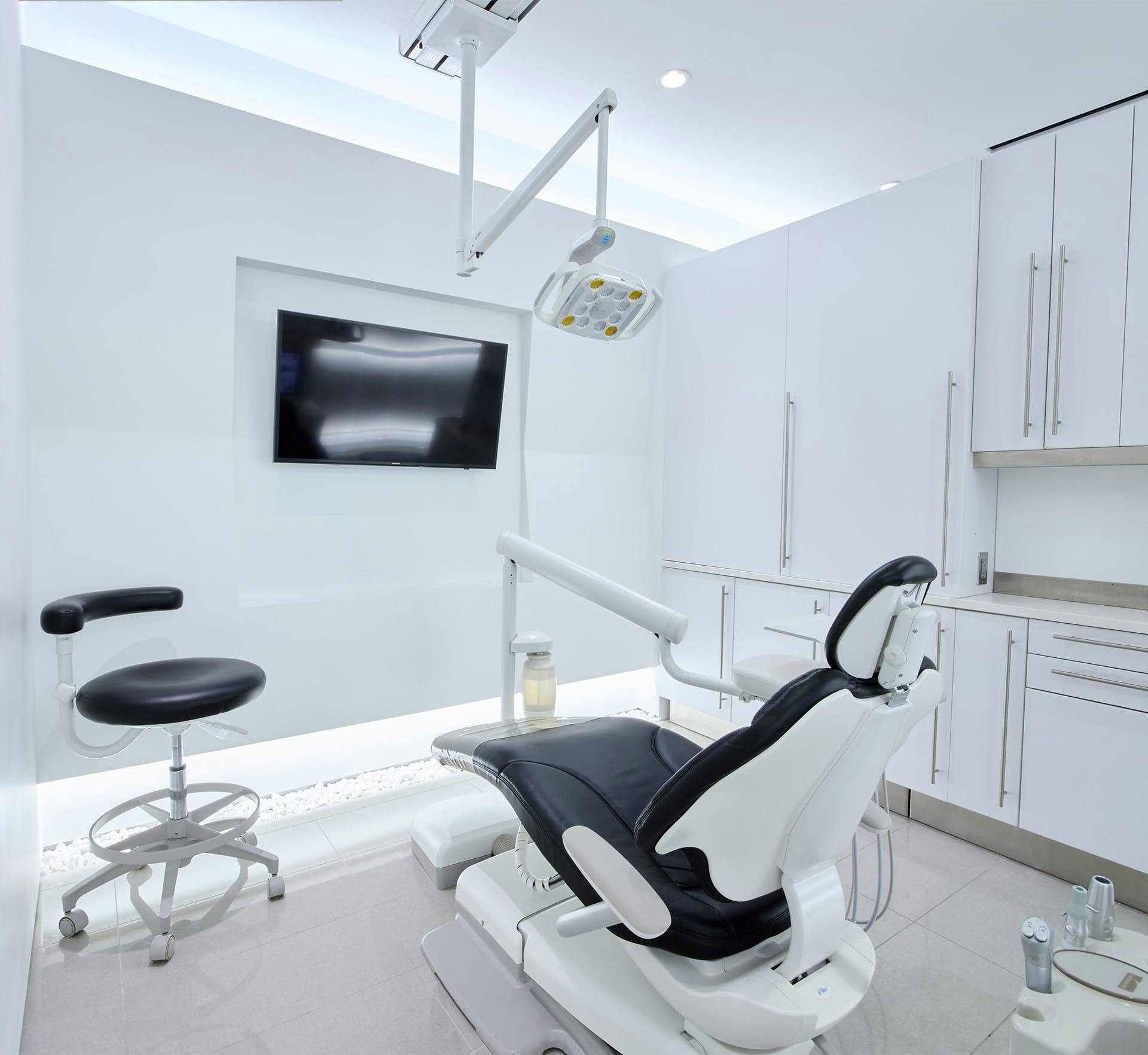room with chair and tv for clients to get their teeth checked