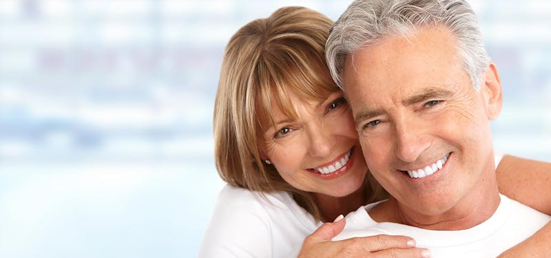 older couple embracing and smiling