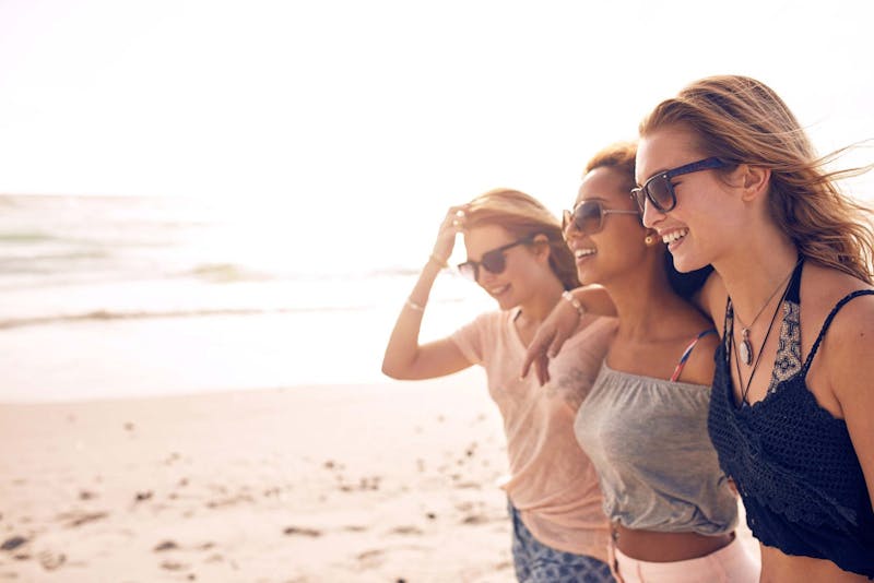 women together on a beach