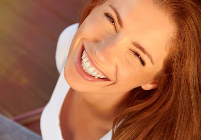 woman looking up smiling