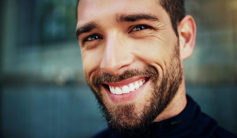 Man smiling showing off healthy dental implants