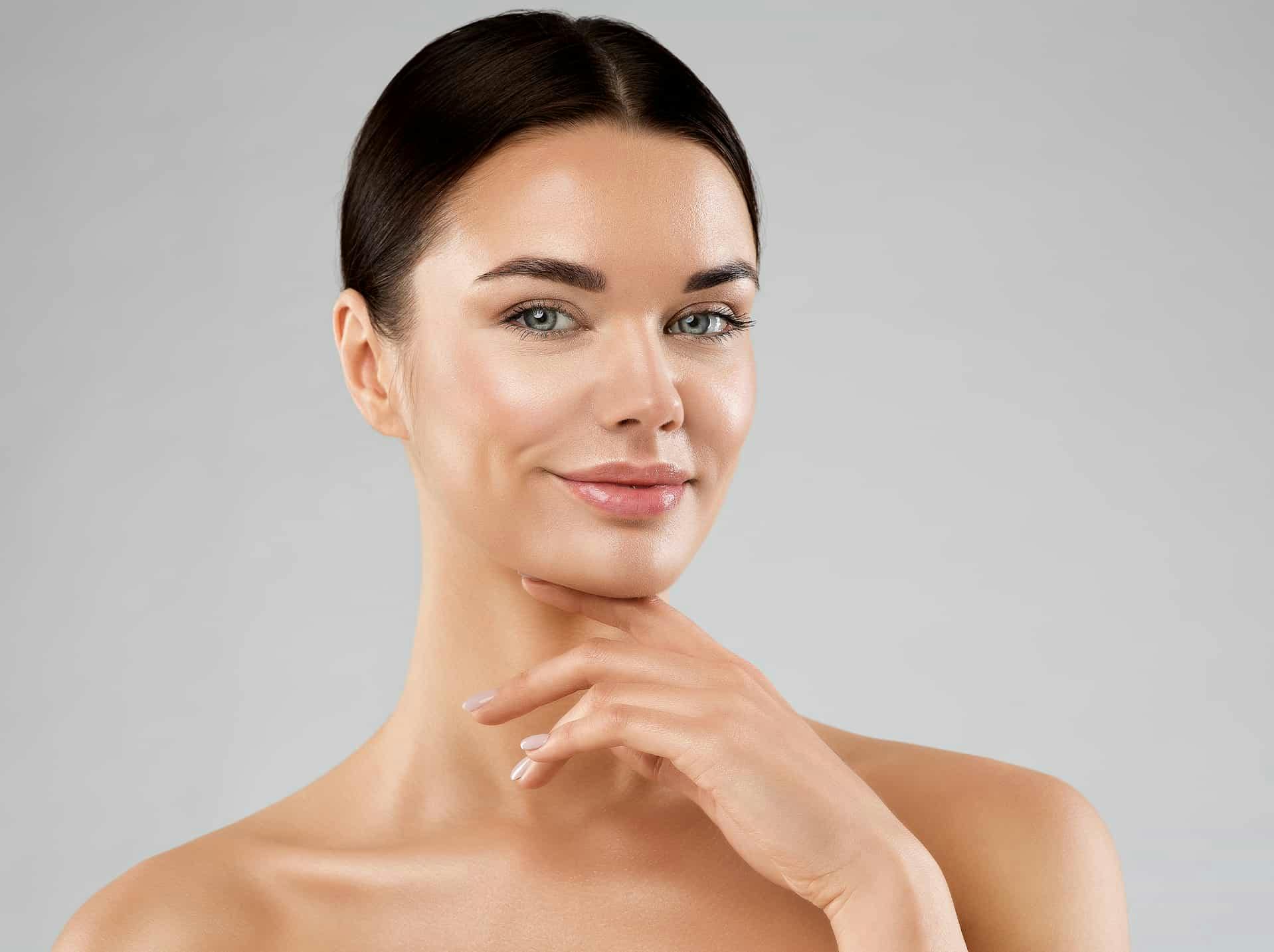 Woman smiling touching chin