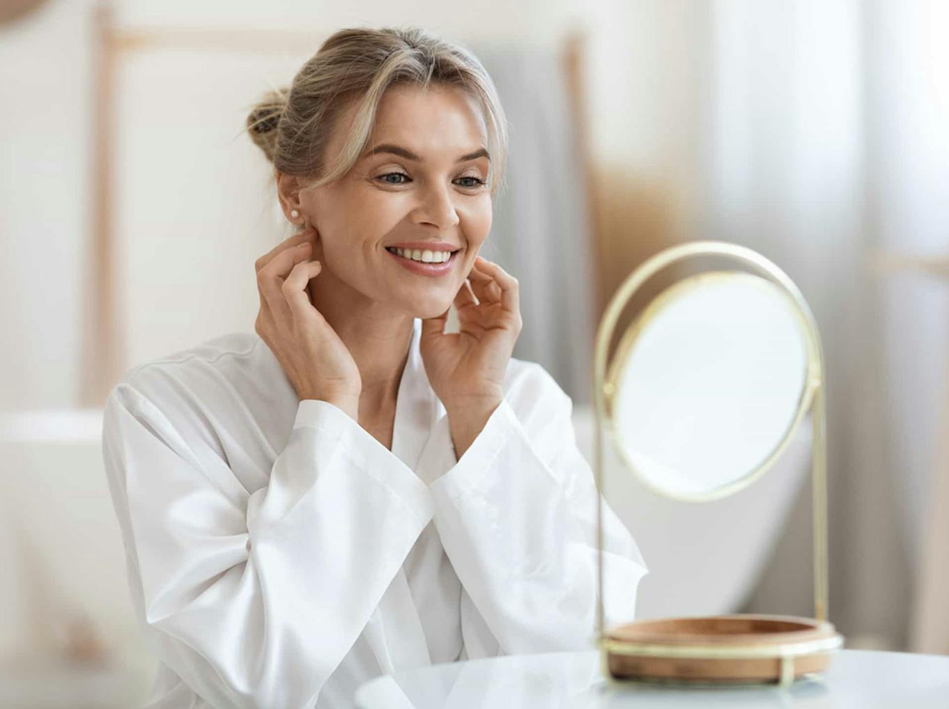 Woman looking at herself in the mirror