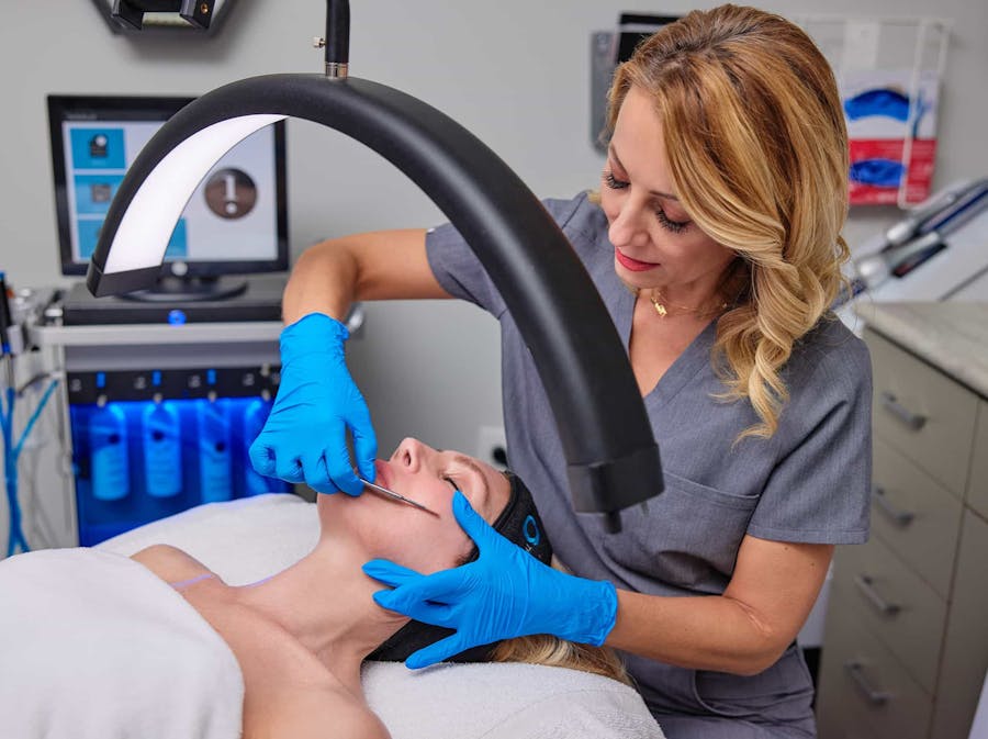 Woman during facial treatment'