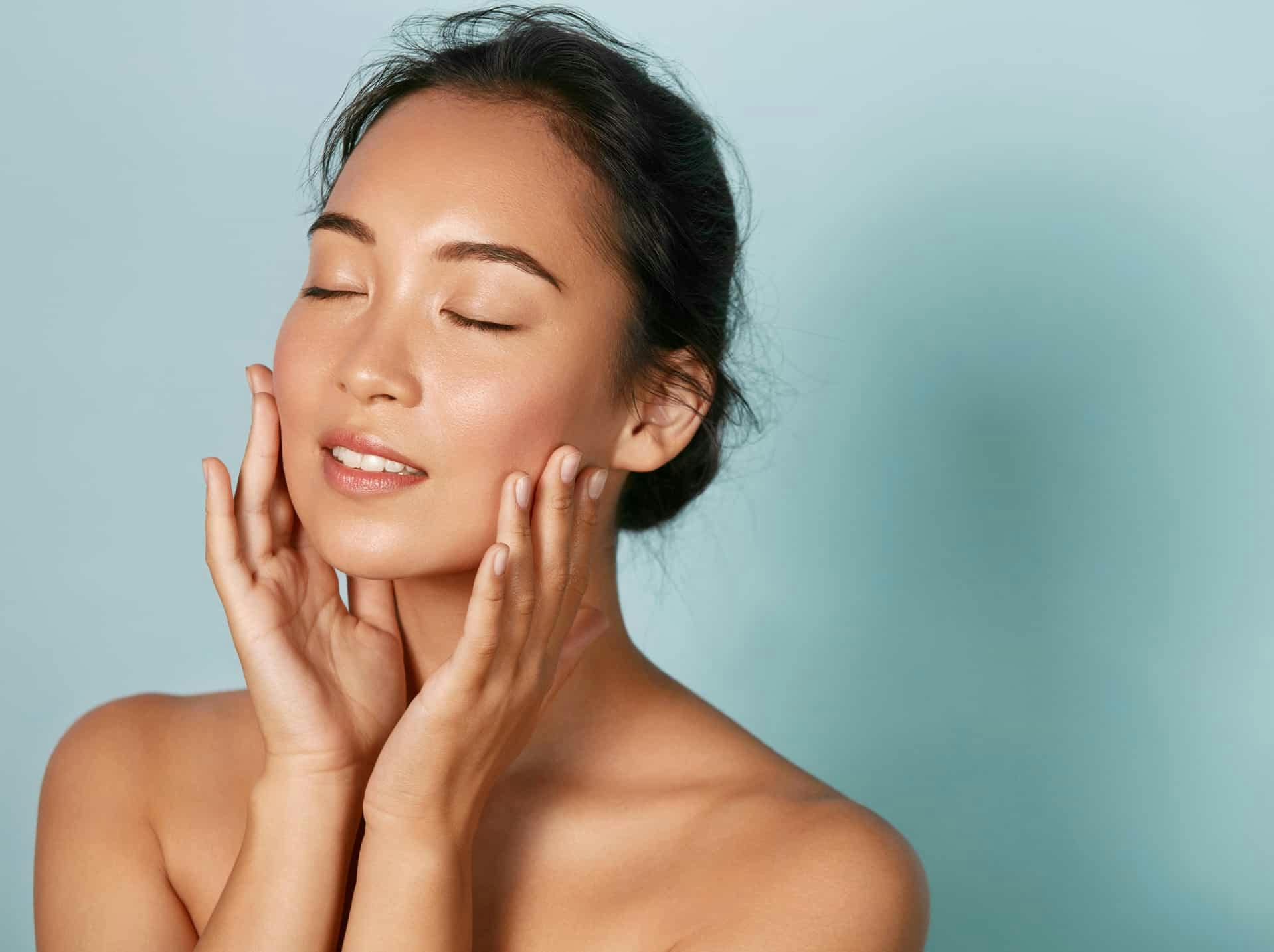 Woman touching face