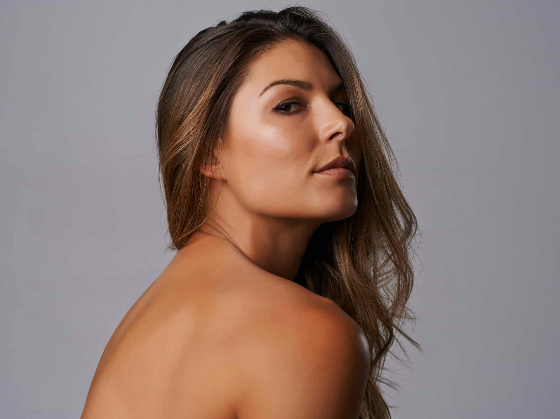 Woman looking over shoulder posing