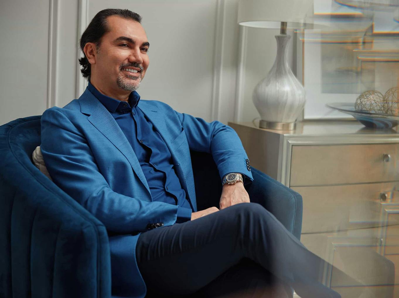 Dr. Aydin sitting in a chair