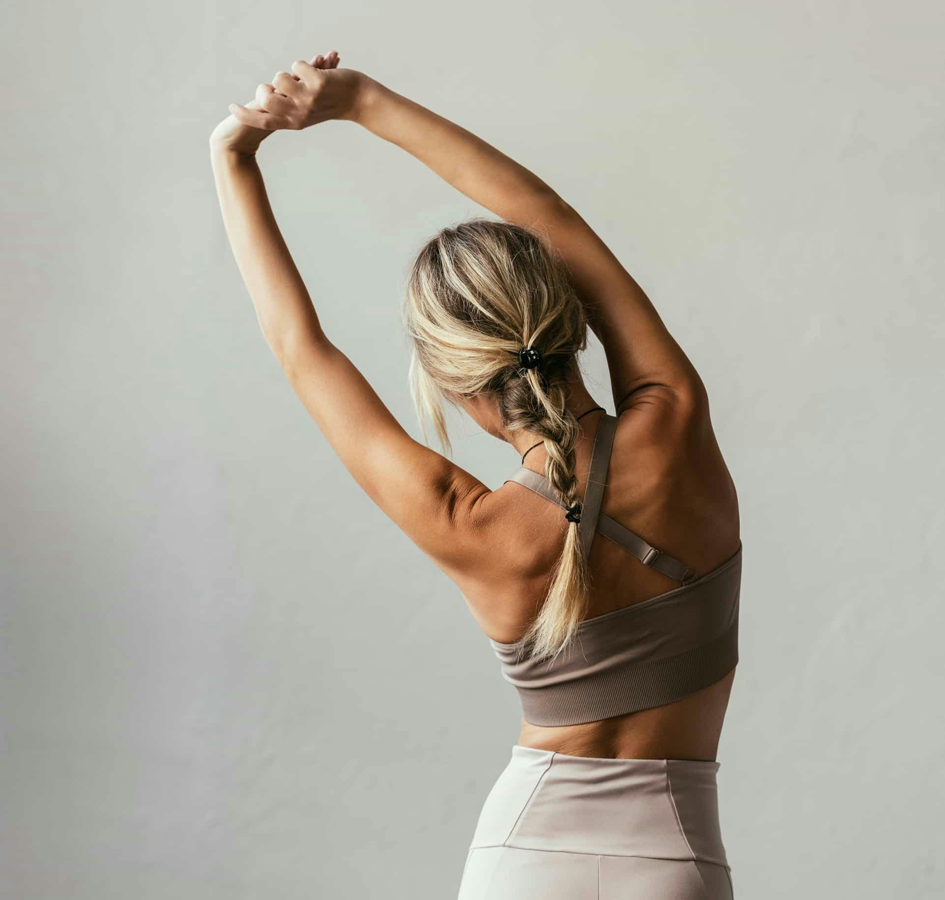 Woman from behind stretching