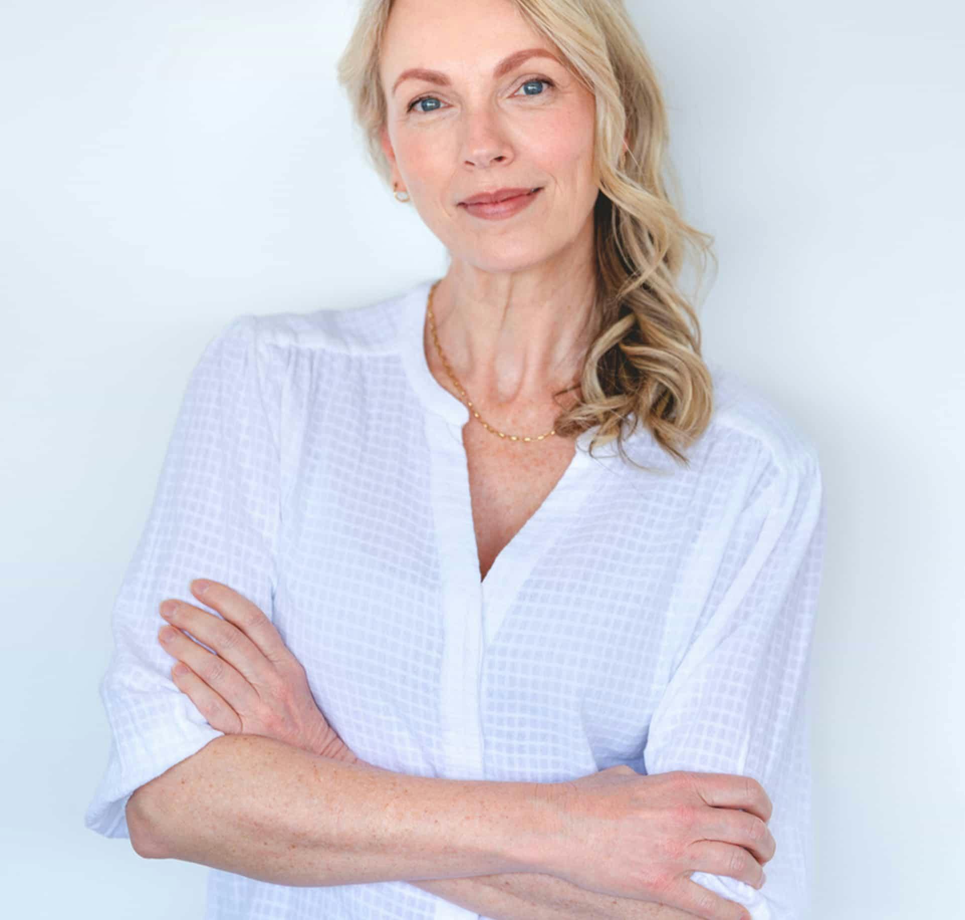Woman in white shirt smiling