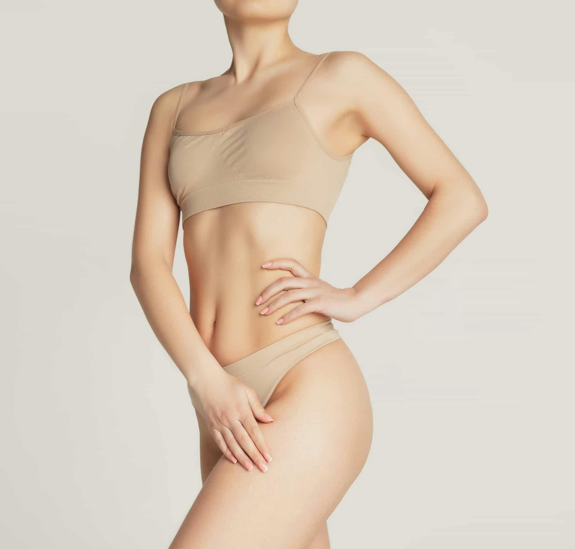 Woman in tan underwear posing