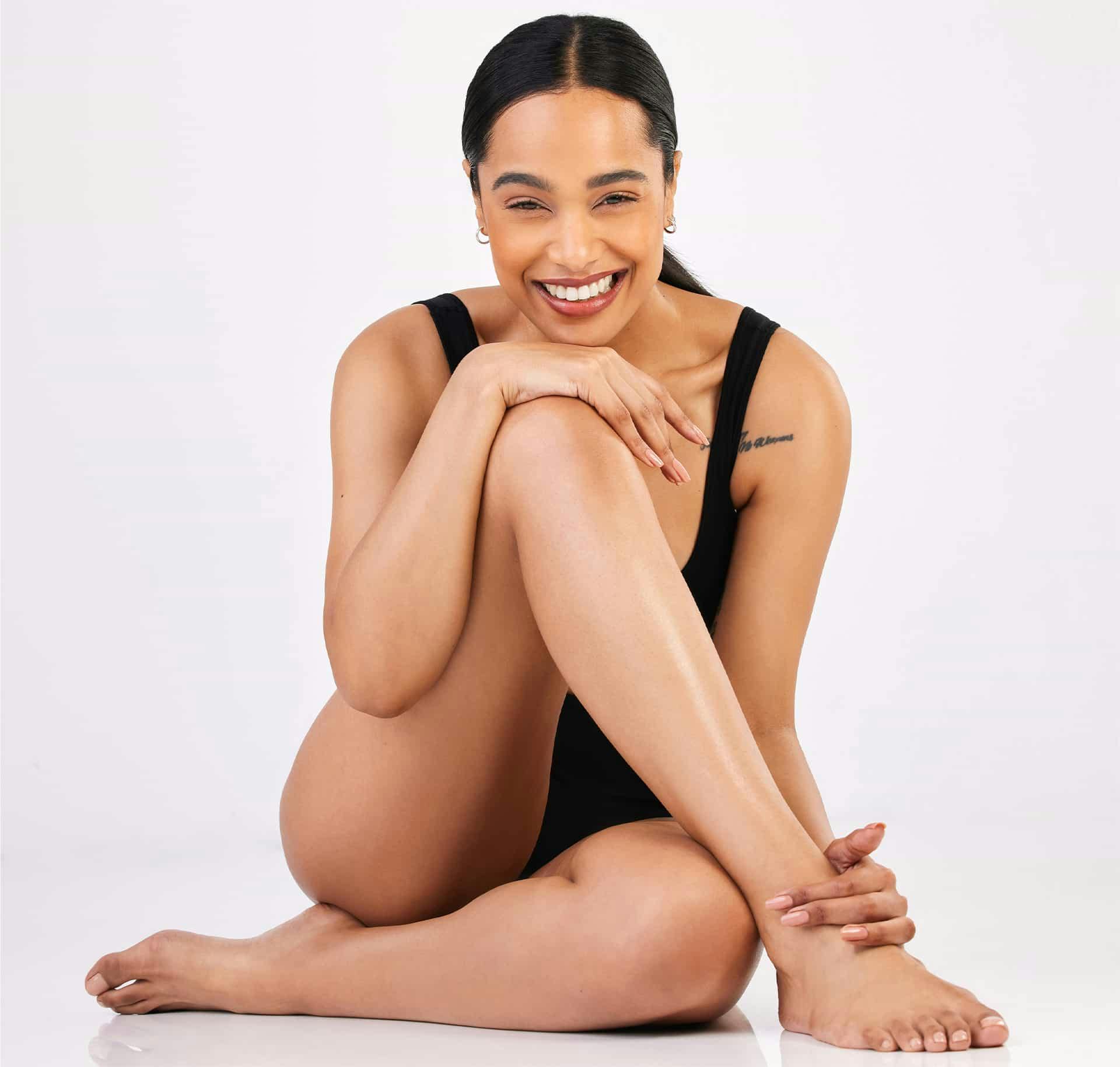Woman sitting on the floor smiling