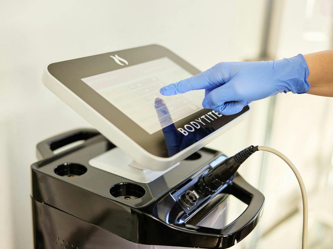 Nurse operating the BodyTite machine