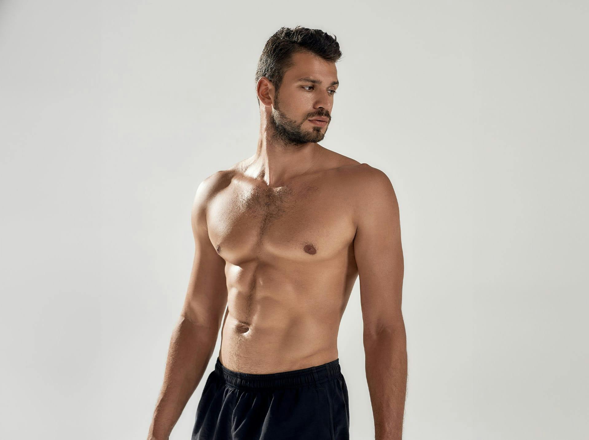 Man in black underwear posing