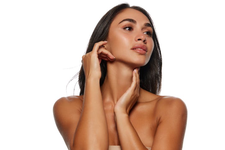woman touching her jaw