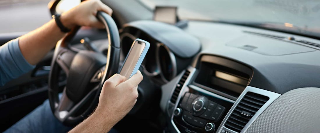 Man on his phone while driving