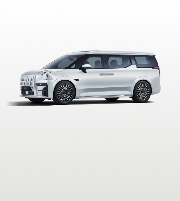 Side view of the Zeekr 009 luxury electric MPV in Crystal White, featuring a bold grille, sleek aerodynamic design, and premium alloy wheels.