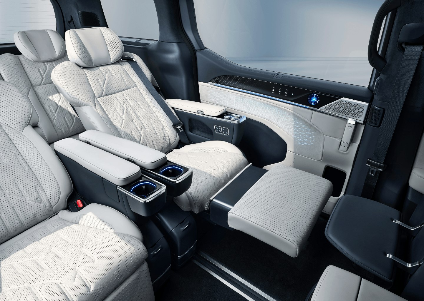 Close-up of the Zeekr 009’s second-row Sofaro First-Class seats, upholstered in premium Nappa leather with quilted stitching, featuring reclining leg rests, integrated cupholders, personal controls, and ambient lighting for ultimate passenger comfort.
