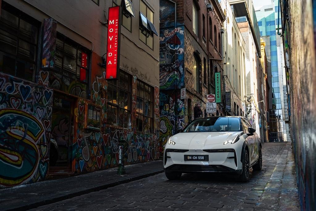 Zeekr X luxury electric SUV in Palace Beige in Hosier Lane with Graffiti