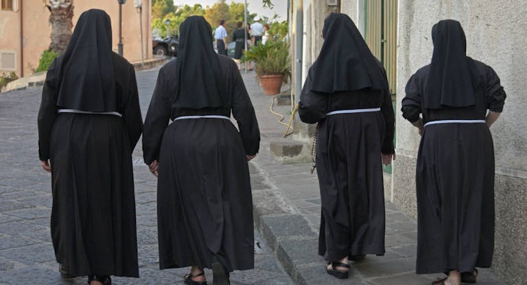 Nuns walking to church, in Lipari, Sicily