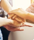 Hands stacked on top of each other