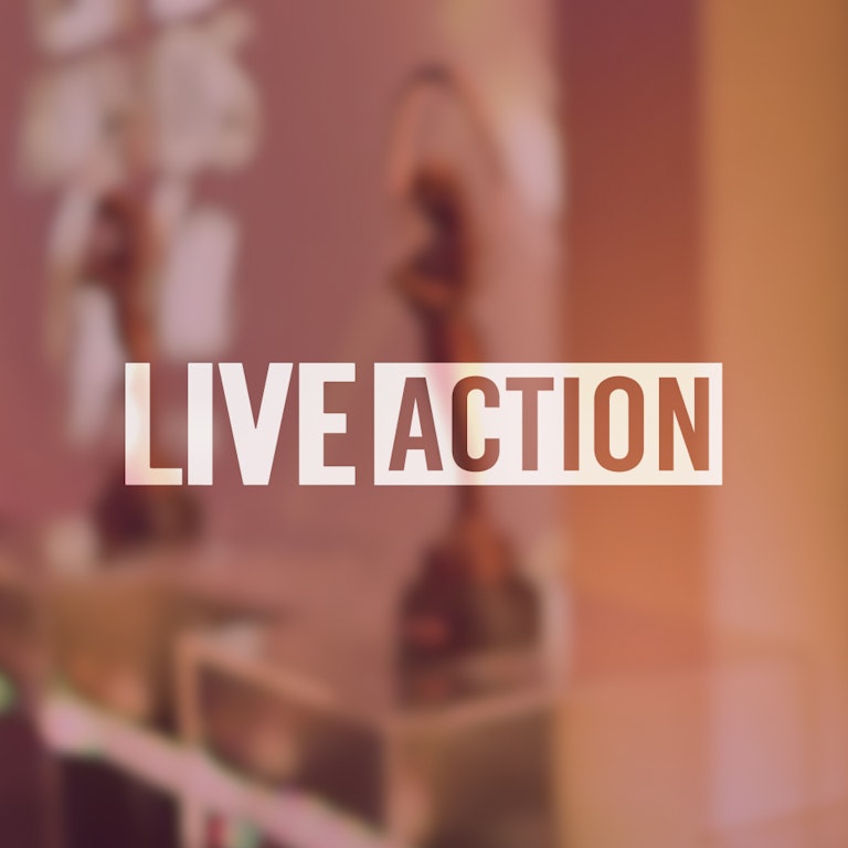 live action logo with awards in the background