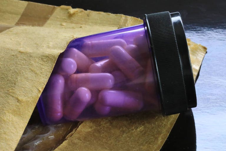 Prescription medicine bottle in a international shipping package