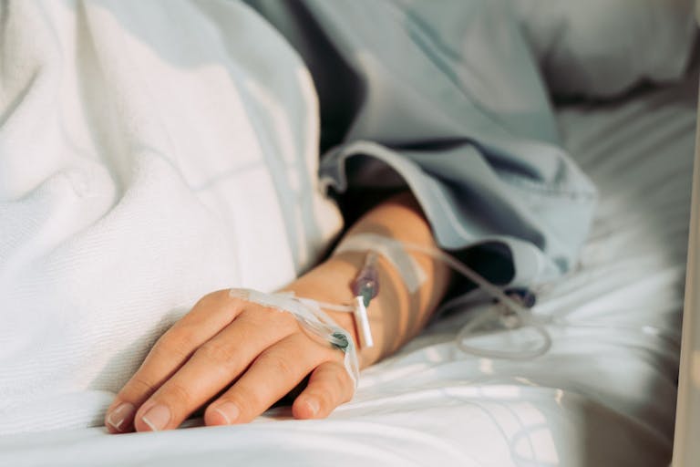 Asian woman lying sick in hospital.