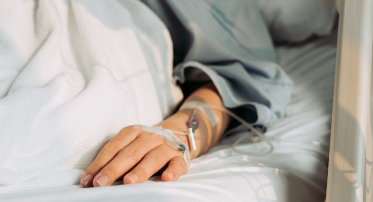 Asian woman lying sick in hospital.