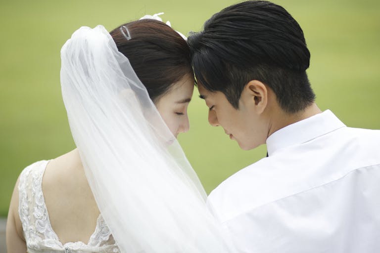 Bride and groom touching foreheads